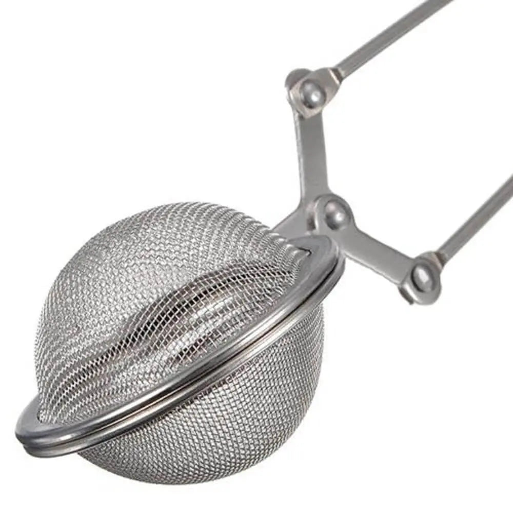Pince à thé balle La P’tite Tasse – accessoire pratique et original en forme de balle, idéal pour saisir facilement les sachets ou infuseurs de thé.